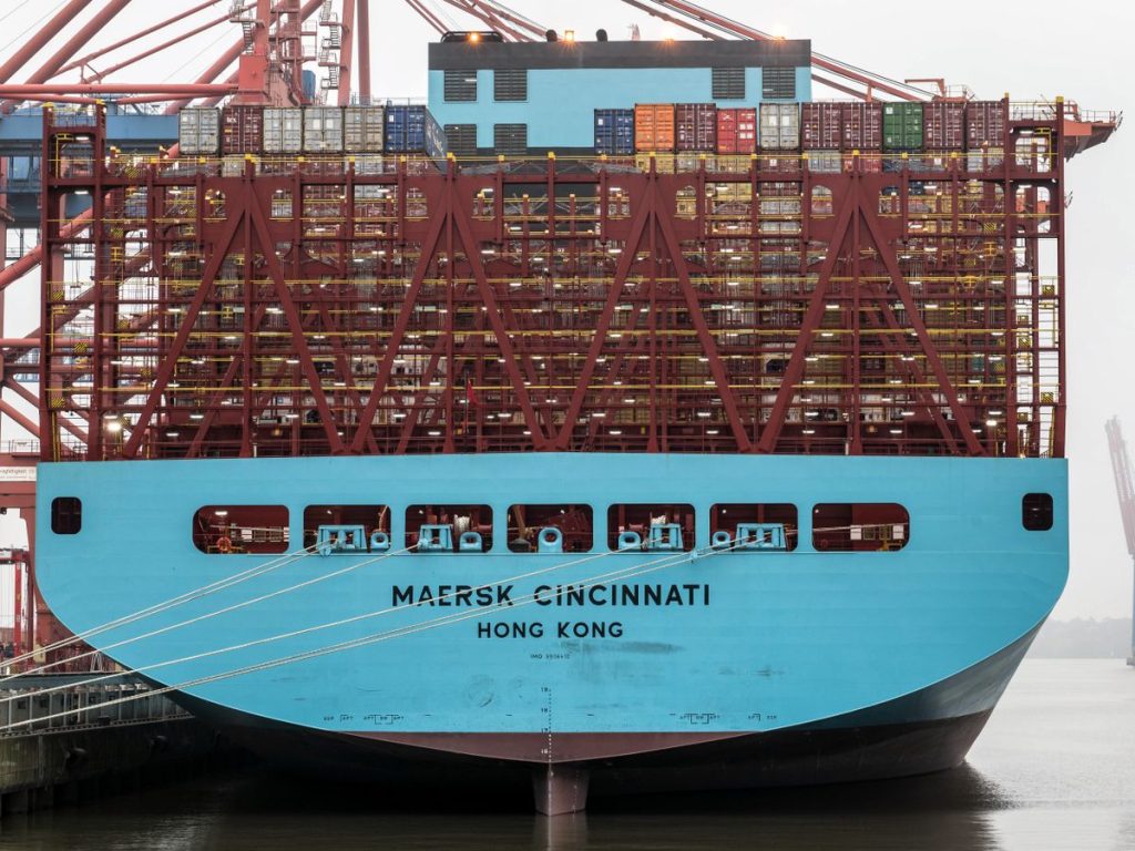 Container ship docked at port for international cargo shipping