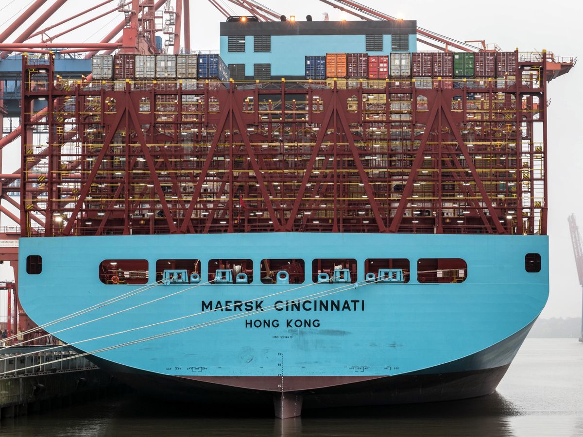 Container ship docked at port for international cargo shipping