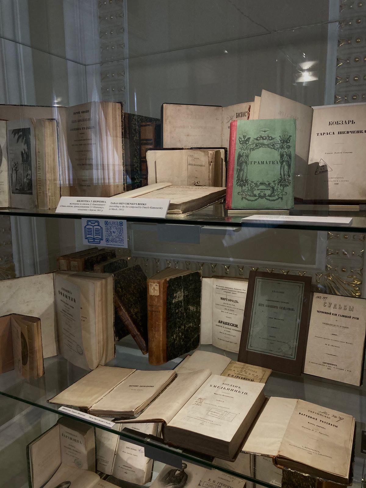 Antique books and historical documents preserved in a museum archive with archival-grade vacuum storage solutions