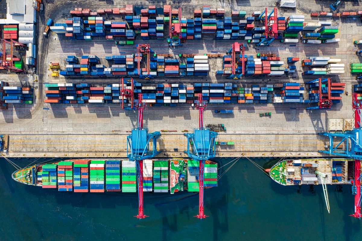 Aerial view of freight shipping containers at a busy cargo port