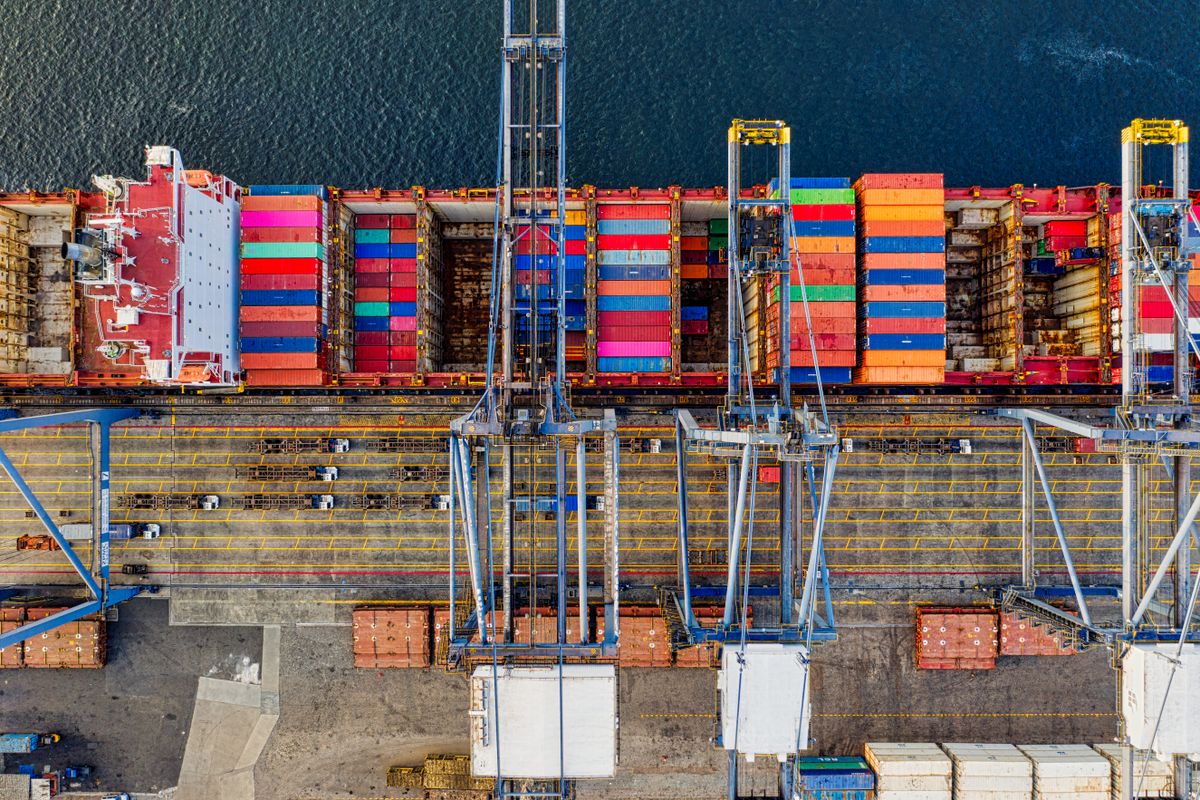 Aerial view of cargo container ship at shipping port for international trade