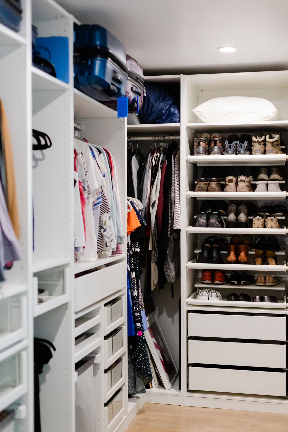 Organized wardrobe with vacuum storage bags maximizing closet space in urban apartments