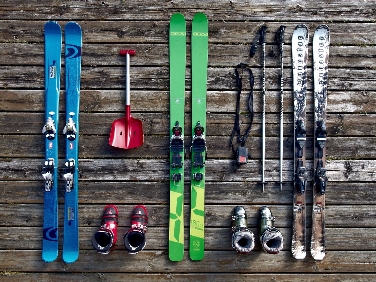 Ski and snowboard equipment flatlay — winter sports gear that benefits from vacuum storage