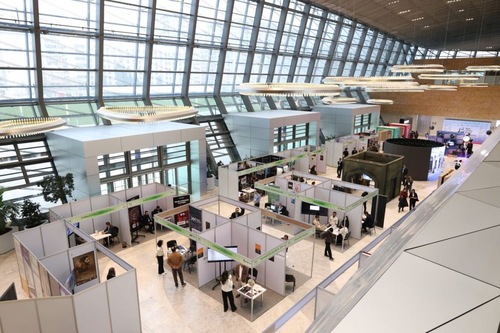 Modern trade show exhibition hall with attendees - vacuum bag industry expos